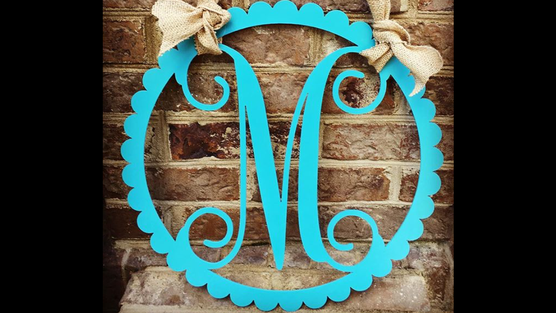 ''Monogram in scalloped circle frame